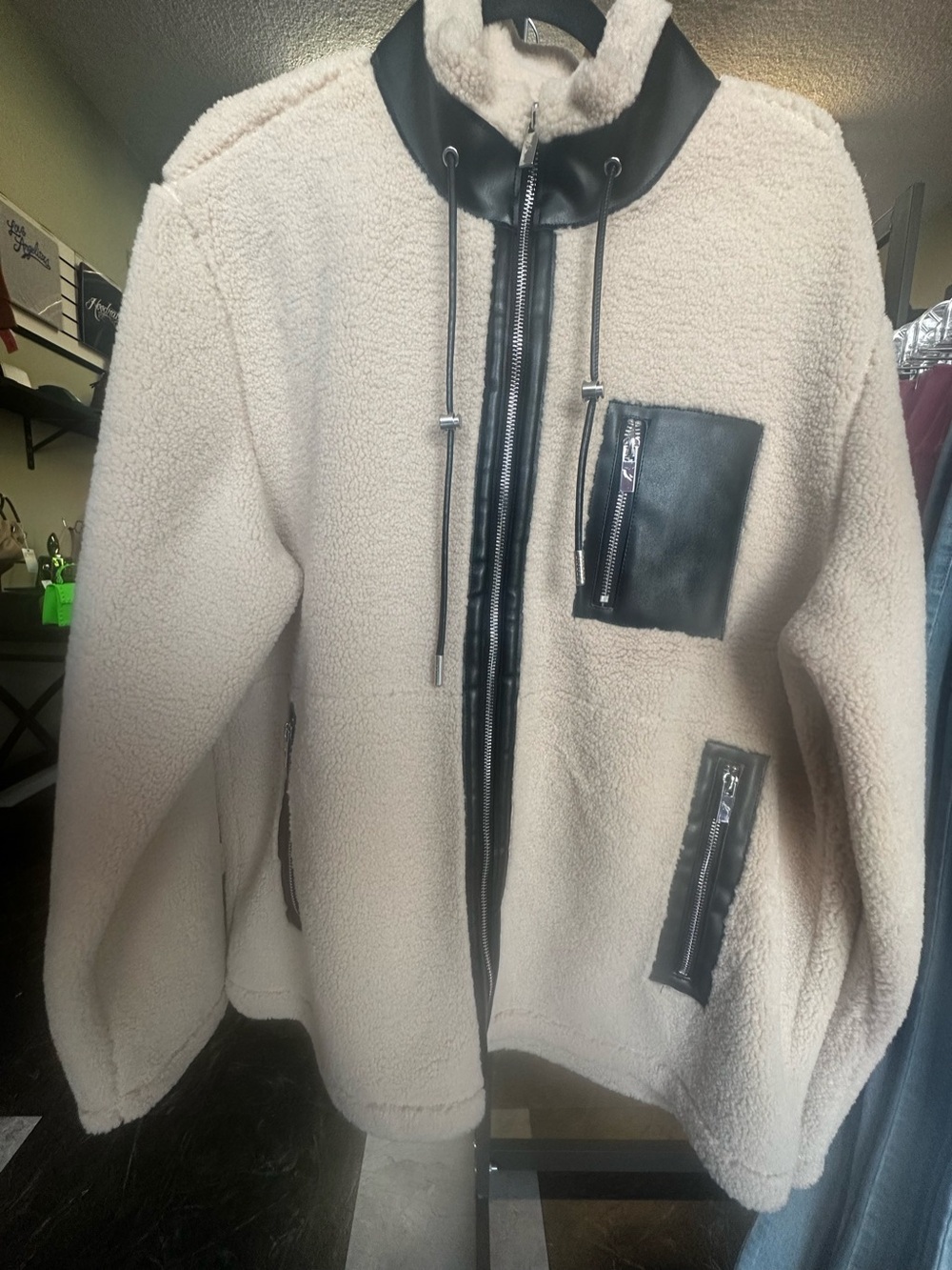 Cream Sherpa Jacket with Black Trim and Zipper Details